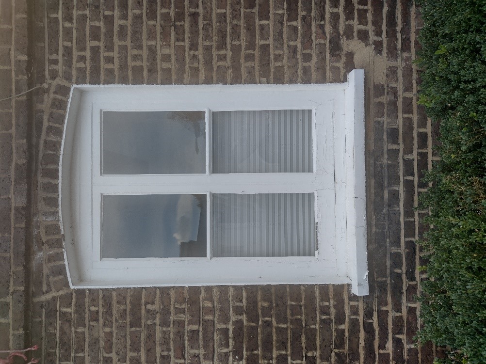 Figure 92 Timber casement window with simple rounded brick arch at 163 High Street