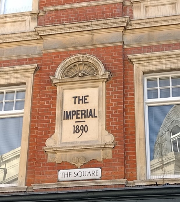 Plaque with building name and date inscription, The Square