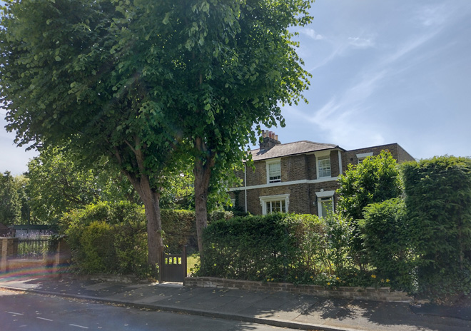 Figure 14: 3 Trafalgar Road, with two-storey side extension, and a pair of mature trees to the front. It is one of the few buildings in the Conservation Area which does not have railings as front boundary treatment