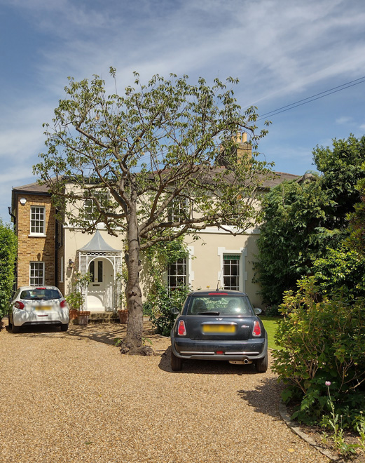 Figure 15: 4 Trafalgar Road, with a two-storey side extension set back from the original building line. It has retained its original porch with decorative trellis work. The majority of the front garden has been given over to hardstanding