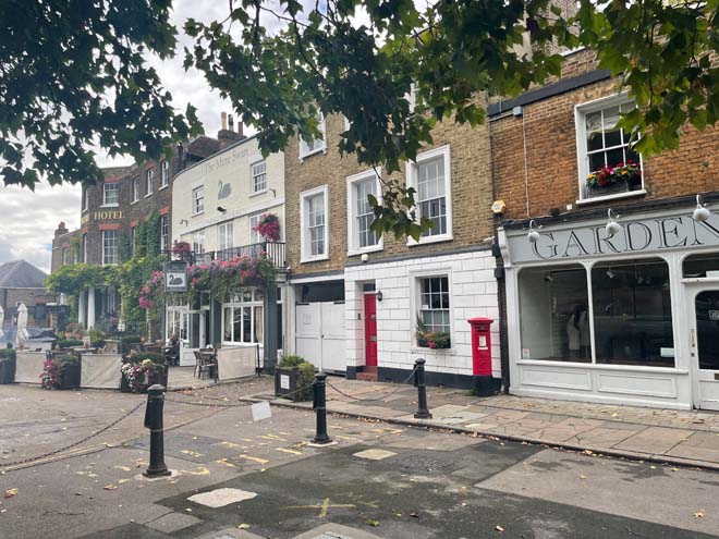 Fig. 34 Mitre Hotel on the left, The Mute Swan in the centre, Palace Gate on the right.