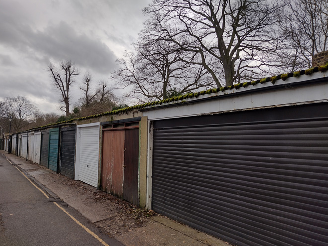 Fig. 41: Single storey garage line the southwest side of the road