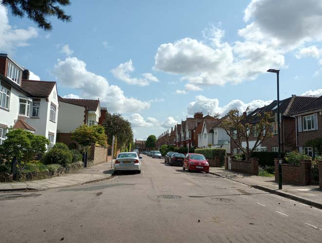 Figure 197: View looking east along Laurel Road with the gables of the Lion Houses visible in the distance