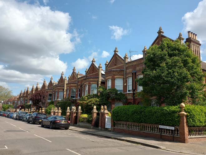 Figure 196: View looking north-east up Hillersdon Avenue with the distinctive gables of the Lion Houses